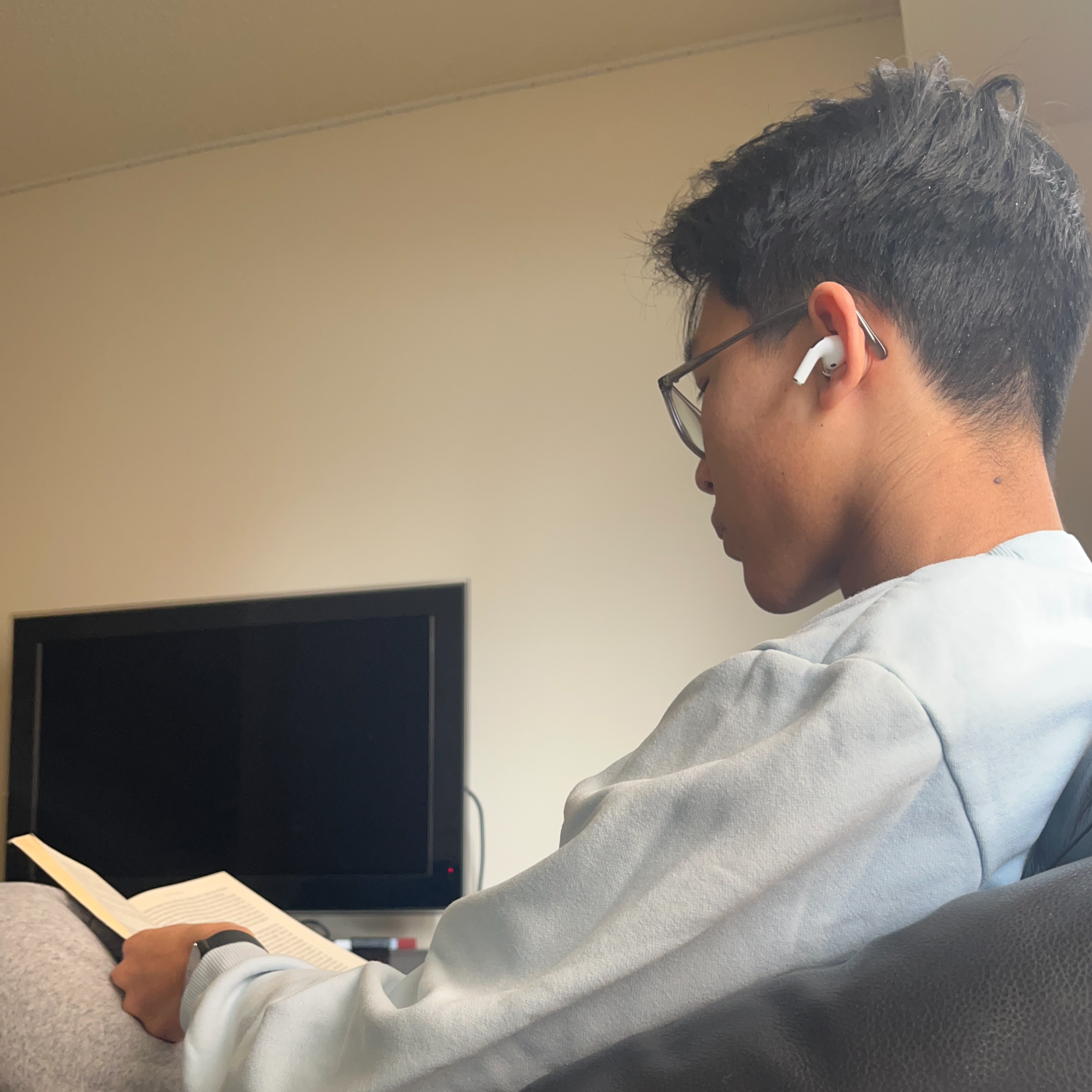 Alan reading a book to relax